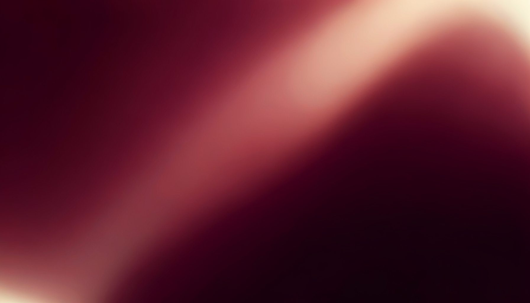 Soft burgundy gradient fading into deep wine with warm cream highlights, calm and cinematic mood